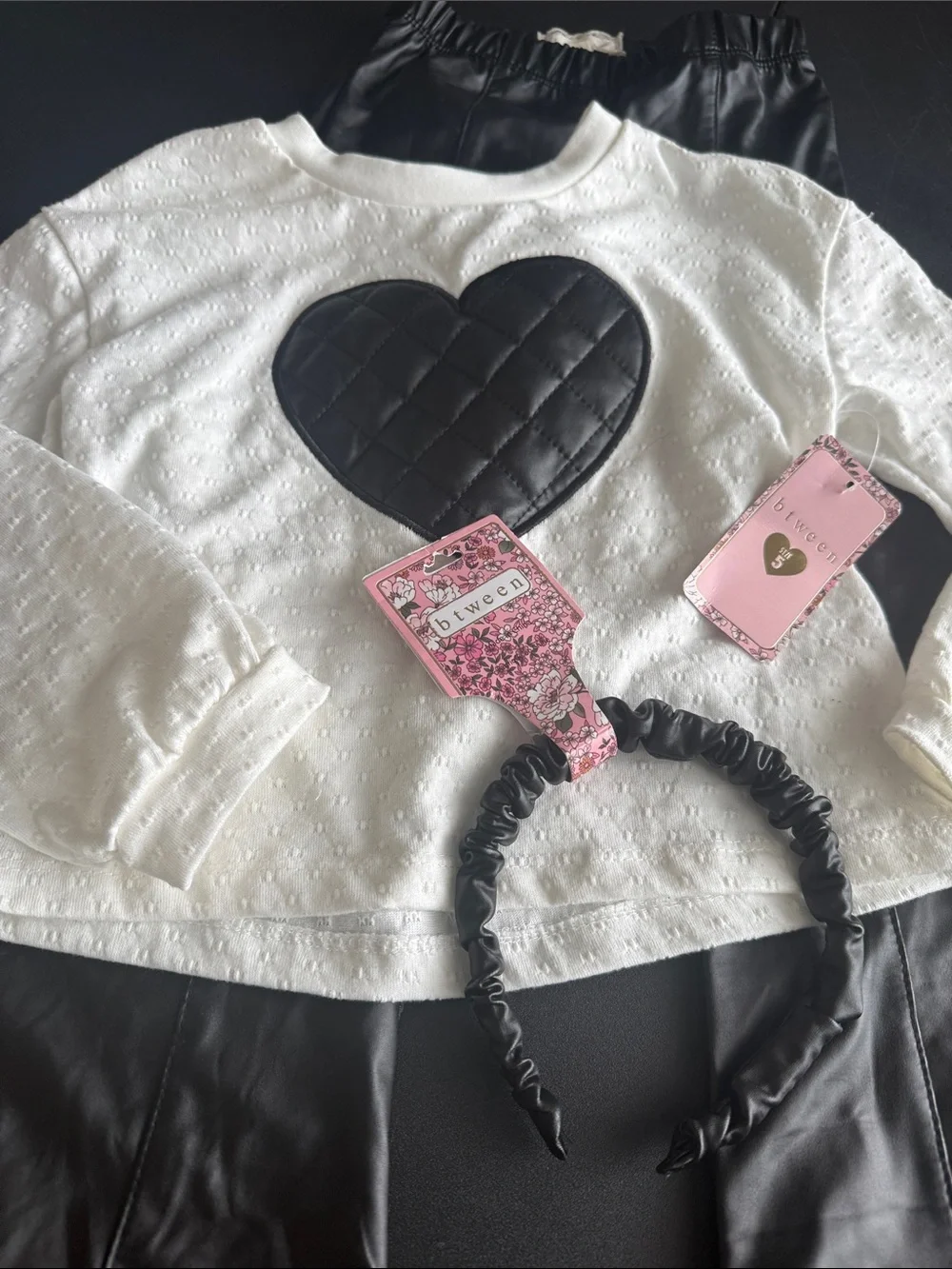 btween White Knit Top with Black Quilted Heart and Black Faux Leather Pants Set